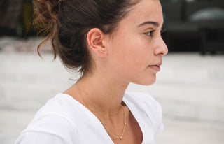 girl with necklace and crawler earrings