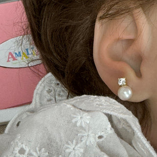 18K Solid Yellow Gold Pearl and Zirconia Screwback Earrings  show on the ear of a baby girl
