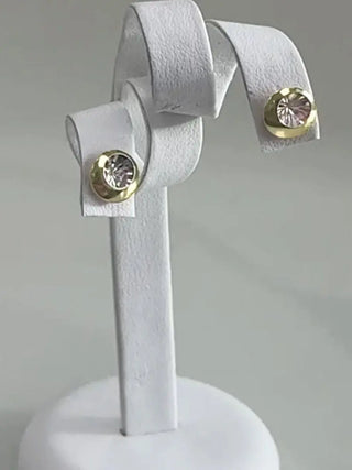 18K Two Tone Round Illusion Diamond Stud Earrings in a stand