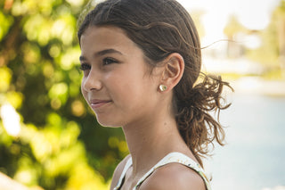 girl with heart earrings